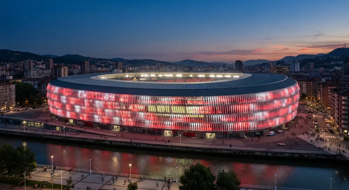 O que fazer em Bilbao: Estádio San Mamés iluminado ao entardecer, às margens da Ría do Nervión